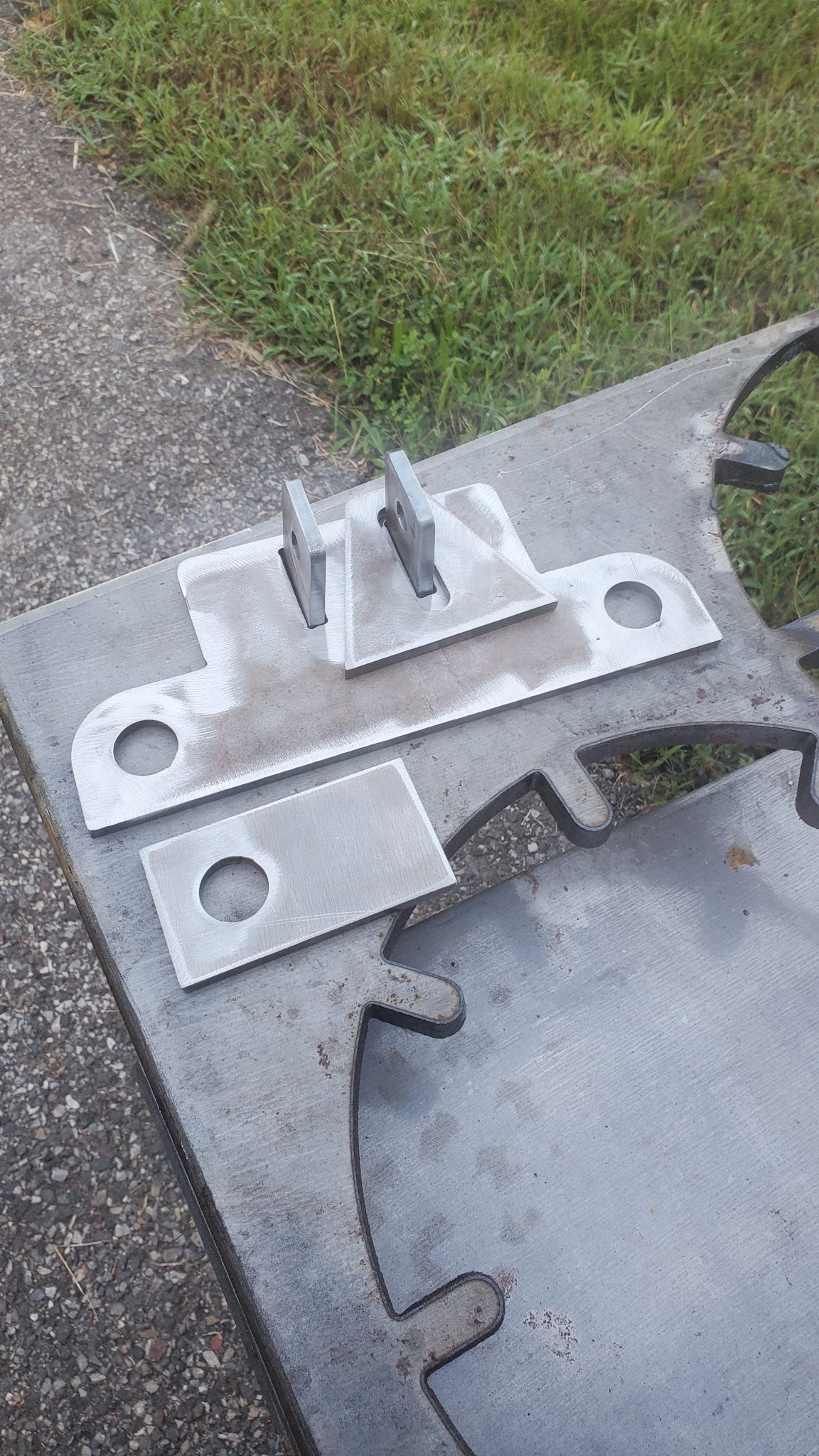 Custom-cut steel mechanical part manufactured by CMDI near Wytheville, Virginia.