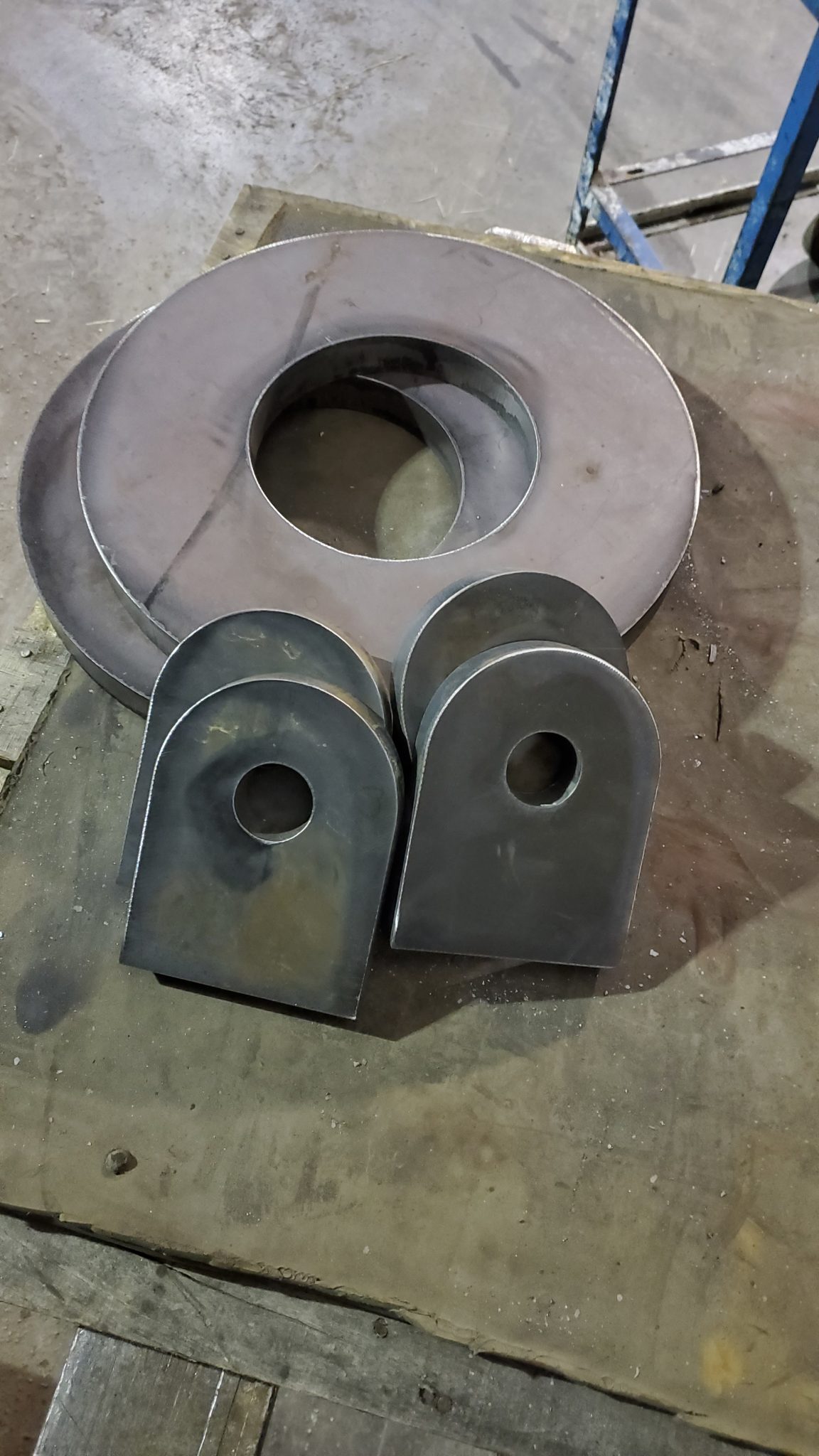 Cut and beveled metal brackets and rings fabricated in Ivanhoe, VA by CMDI.