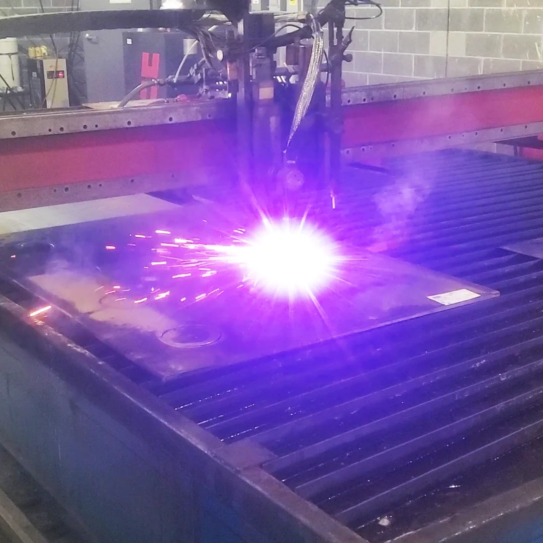 Plasma cutting steel plate on industrial cutting table in Virginia