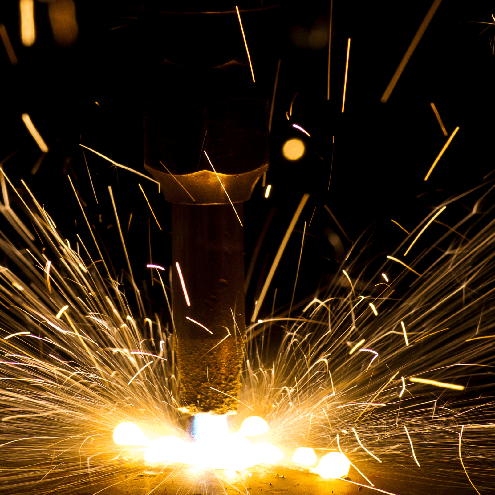 Oxyfuel metal cutting with sparks flying at CMDI in Southwest Virginia
