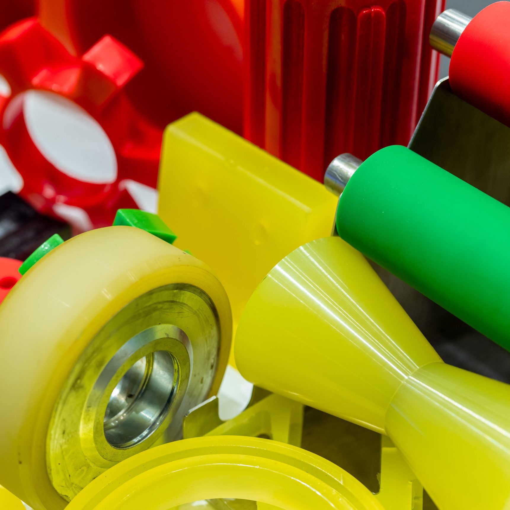 Polyurethane components bonded to metal inserts for industrial applications