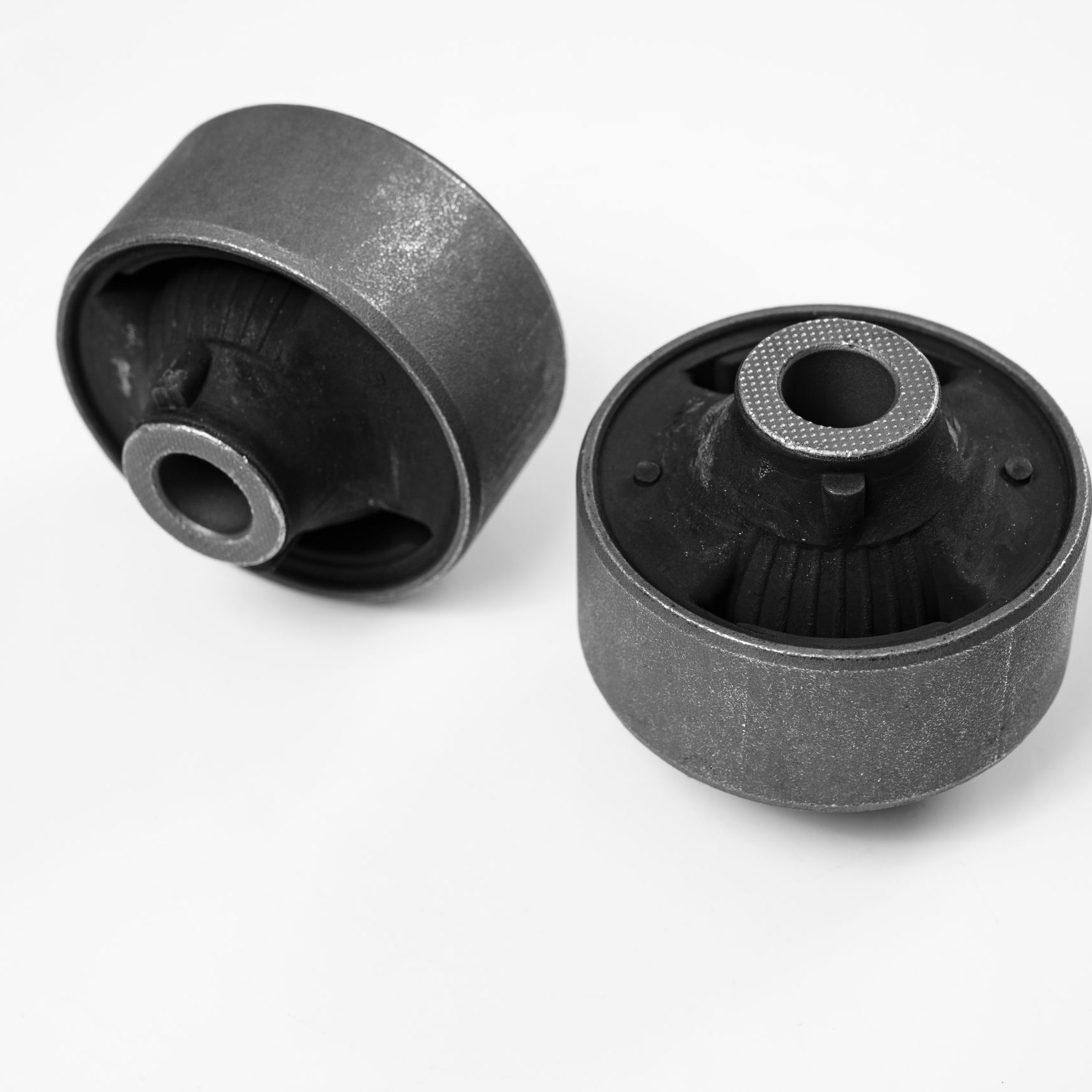 lever silent block against a white background. rubber metal hinge, the elastic part is connected to the inner and outer bonds by vulcanization when manufactured or by glue. Car parts store.